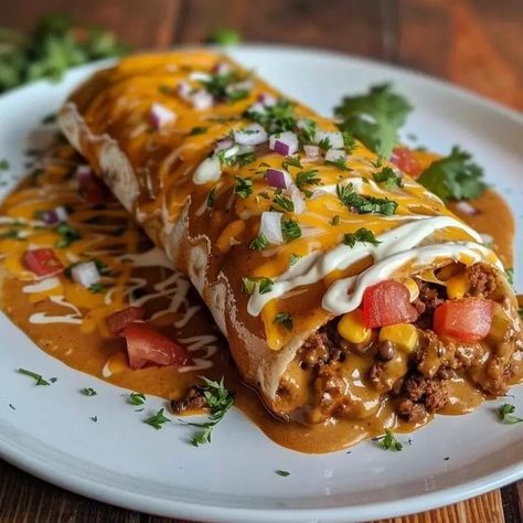 Wet burritos are a beloved comfort food, known for their hearty fillings, rich sauces, and cheesy toppings. They bring together the best elements of traditional Mexican cuisine in a single, indulgent dish. The name “wet” comes from the generous amount of sauce that smothers the … El Monterey Burritos Recipes, Beef Wet Burrito Recipe, Wet Burrito Sauce, Wet Burrito Recipe Ground Beef, Sloppy Joe Burrito, Brisket Burritos, Wet Burrito Recipe, Mini Burritos, Wet Burrito Recipes