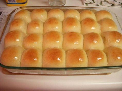 CAKE MIX DINNER ROLLS 2½ cups warm water (110°) 2 pkg. (4½ tsp) active dry yeast 1 (15.25 oz – 18 oz) yellow cake mix (Duncan Hines French Vanilla) 1 Tbsp. oil 5 cups plain flour 1½ tsp salt 4 Tbsp. butter, melted - for spreading after they come out of oven In bowl of mixer, pour warm water, sprinkle yeast over warm water, then sprinkle with cake mix. Let sit 5 minutes. Add oil, flour, and salt, mix all together. Knead to combine everything and make a smooth ball. Cover with a warm damp towel or Cafeteria Rolls, School Lunchroom, Easy Yeast Rolls, Yeast Rolls Recipe, School Cafe, Pembuat Roti, Mixer Recipes, School Recipes, Active Dry Yeast