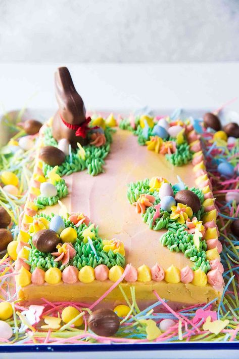 Pastel Easter Cake - This gorgeous Easter sheet cake is a cinch to decorate with buttercream decorations and your favourite Easter candy! It's perfect for a crowd and is the best butter and soft vanilla cake! Easter Sheet Cake, Sheet Cake Decorating Ideas, Sheet Cake Decorating, Sheet Cake Ideas, Sheet Cakes Decorated, Easter Cake Decorating, Best Vanilla Cake Recipe, Easter Cake Recipes, Sheet Cake Designs