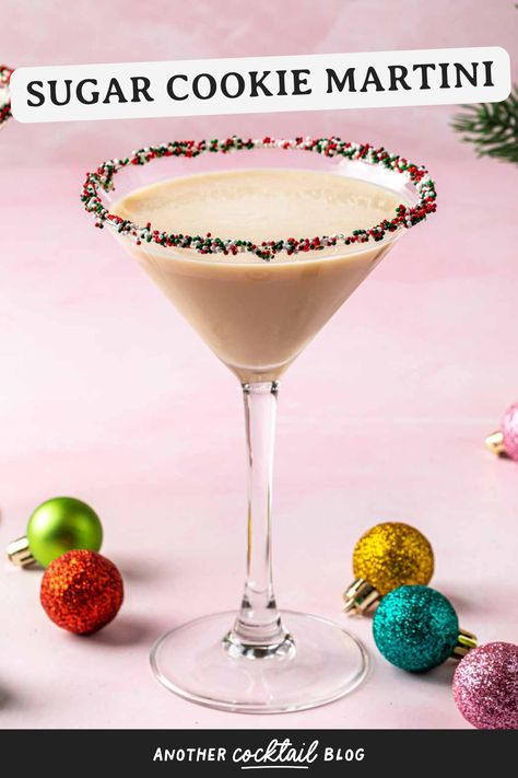 Just like your favorite Christmas cookie, this sugar cookie martini is sweet and festive. Made with whipped cream vodka, Irish cream, and a hint of amaretto, it's the perfect way to celebrate the holidays. Cookies And Cream Martini, Cookie Butter Martini, Sugar Cookie Espresso Martini, Christmas Cookie Martini, Snickerdoodle Martini, Sugar Cookie Cocktail, Cookie Martini Recipe, Sweet Martini Recipes, Sugar Cookie Martini Recipe