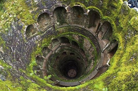 The Initiation Wells, Sintra, Portugal: Located in the Quinta de Regaleira palace, The Initiation Wells are two underground towers that were once used for ceremonies, including Tarot rites. Mysterious Places On Earth, Quinta Da Regaleira, Witches Of East End, Day Trips From Lisbon, Underground Tunnels, Sintra Portugal, Mysterious Places, Stonehenge, Angkor