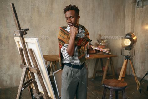 Smiling painter with canvas standing near easel by NomadSoul1. Smiling painter with canvas standing near the easel. Male artist draws at his workplace, creative master works in wor... #AD #easel, #Male, #standing, #Smiling Painting Stand Drawing, Painting Easel Aesthetic, Artist Easel Aesthetic, Person Painting On Easel, Diy Easel Stand For Painting, Male Artist, Inspiring Art, Icons Design, True Blue