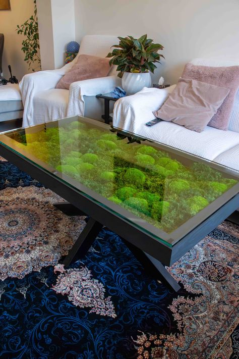 These moss tables are not only functional but also bring a touch of nature into any space. Made with sustainable materials, these tables are perfect for eco-conscious individuals who want to add a unique and organic element to their home or office. The natural moss on the tabletops creates a calming and serene atmosphere, while the sleek and modern design adds a contemporary touch. #mosstables #natureinspiredfurniture #sustainableliving #organicdesign Moss Coffee Table, Office Greenery, Moss Ideas, Biophilic Interior, Moss Table, Moss Walls, Artificial Grass Wall, Labyrinth Design, Wood Burning Techniques