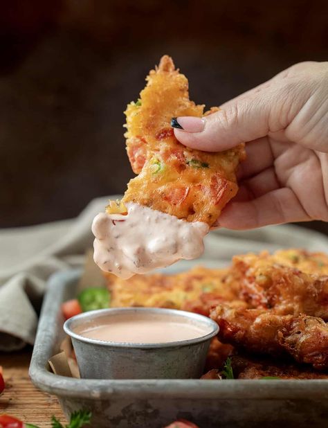 Tomato Fritters are crispy, tomato-packed fritters bursting with Roma tomatoes, cheddar cheese, and a hint of heat from a jalapeno pepper. Then, they are dipped in a creamy and tangy dipping sauce. (This sauce is AMAZING with these fritters!) They make a fantastic appetizer, snack, or side dish, and their vibrant appearance and delightful taste are sure to please! Tomato Fritters, Tomato Dipping Sauce, Horderves Appetizers, Cheese Bread Recipe, Jalapeno Pepper, Corn Fritters, Roma Tomatoes, Stuffed Jalapeno Peppers, Vegetable Side Dishes