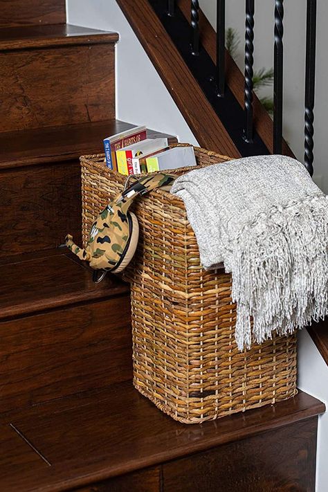 This unique-shaped woven wicker basket is designed to sit securely on two steps on your staircase to collect items like toys, clothes, books, mail, magazines, blankets, supplies, shoes, and an endless assortment of other little things throughout the day that eventually need to make a trip upstairs... all at once. Basket For Stairs, Stairs Basket, Stair Basket, Ceiling Curtain Track, Wicker Material, Shoe Organizer Entryway, Plastic Storage Totes, Stair Stickers, Storage Totes