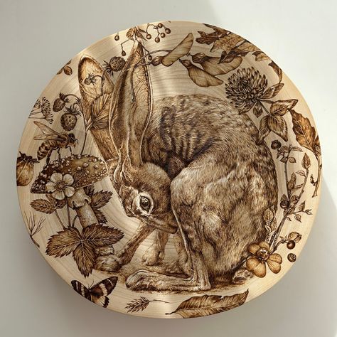 "\"Hide and Seek\" Pyrographic art. Incredibly detailed work. The wonderful Hare is playing hide and seek. He hides in a vortex of forest plants and insects. The picture is burned on a wonderful section of poplar. Light and pleasant to the touch wood. It is my favorite work that should find its connoisseur." Woodburning Crafts, Woodburning Art, Pyrography Designs, Spirit Animal Art, Wood Art Projects, Forest Plants, Pagan Art, Pyrography Art, Wood Burning Crafts