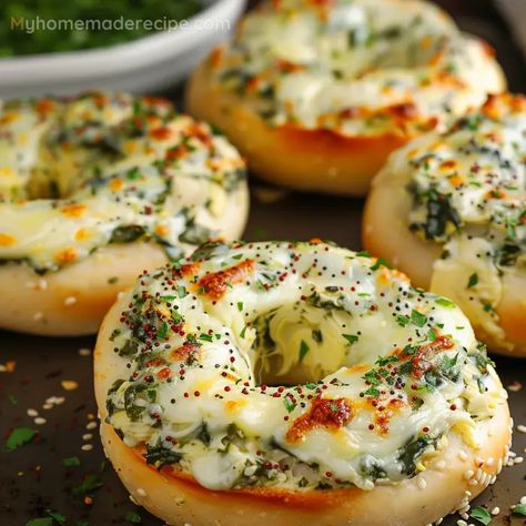 A tasty and easy-to-make bagel recipe featuring a cheesy spinach and artichoke topping. Spinach Artichoke Bagels, Cheesy Spinach Artichoke Bagels, Recipes Using Bagels, Creative Cooking Ideas, Savory Brunch Appetizers, Csid Recipes, Bagel Spread Recipes, Bagel Ideas, Bagel Recipes