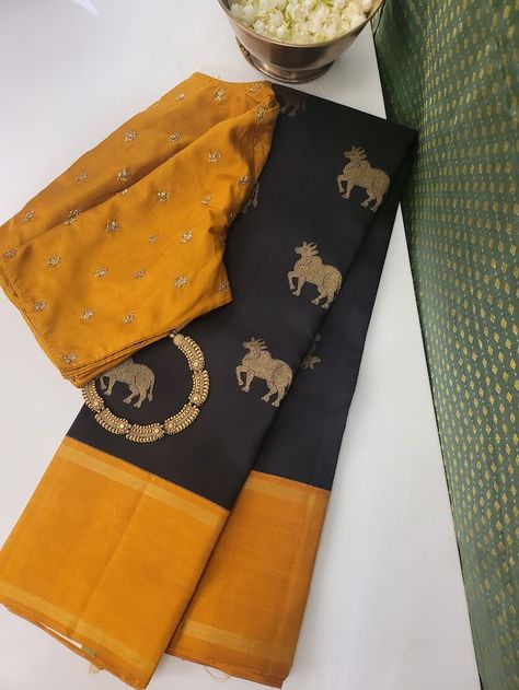 Pure kanchipuram silk saree woven in the korvai style , this saree is a signature Aavaranaa creation. The body has the kamadhenu motifs woven in pure zari, the border is kept simple but the pallu is richly woven in a traditional pattern with mythological figures and other smaller patterns like rudrakshams. This is a black with mustard border. The blouse piece is plain border colour Cotton Silk Saree With Embroidered Border, Mustard Yellow Saree Contrast Blouse, Yellow Traditional Pre-draped Cotton Silk Saree, Gold Cotton Silk Saree With Border, Saree Colours, Yellow Cotton Silk Handloom Pre-draped Saree, Saree Yellow, Silk Sarees Kanchipuram, Korvai Silk Sarees Kanchipuram