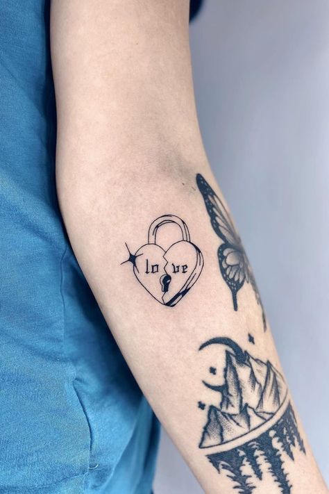 Bad At Love Tattoo, Good Heart Tattoo, Unique Heart Tattoo Designs, Tattoos For Brokenhearted, Love Lock Tattoo, Edgy Heart Tattoo, Heart Themed Tattoos, Bubble Heart Tattoo, Protect Your Heart Tattoo