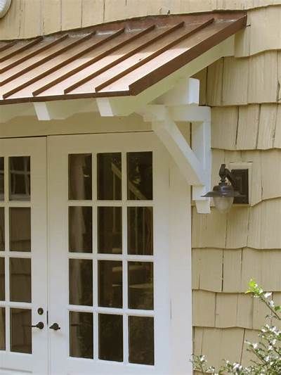 Standing seam metal roof with rafters and brackets. | House exterior, Porch roof, Door overhang Standing Seam Metal Roof Porch, Back Door Overhang Ideas, Front Porch With Metal Roof, Wood Awning Over Door Front Door, Side Door Awning, Door Overhang Ideas, House Exterior Porch, Awning Over Door, Porch Overhang