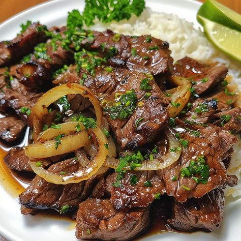 🍛 Try the savory and tangy Bistek Tagalog! 🍋✨ #BistekTagalog #FilipinoCuisine Bistek Tagalog (Filipino Beef Steak) Ingredients: Beef sirloin, sliced thinly (1 lb) Soy sauce (1/4 cup) Lemon juice (2 tbsp) Garlic, minced (4 cloves) Onion, sliced into rings (1) Ground black pepper (1 tsp) Olive oil (2 tbsp) Water (1/2 cup) Salt (to taste) Instructions: Marinate beef in soy sauce, lemon juice, garlic, and black pepper for at least 30 minutes. In a pan, heat olive oil and cook onions until sof... Bistek Tagalog Recipe Beef, Filipino Dinner, Bistek Tagalog, Best Freeze Dried Food, African Cooking, Viet Food, Smoked Meat Recipes, Healthy Fitness Meals, Meat Appetizers