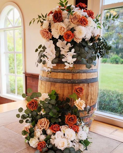 Ceremony backdrop for Abbie and Daniel. Congratulations you guys!!! The light-filled chapel at Immerse is the most beautiful place to say "I do" Wine barrel floral huggers never looked so good with the matching floor arrangements to tie it all together. Not to mention the pretty pew flowers we added. Stay tuned for our next post! #weddingflowersdecoration #flowersforwedding #luxuryweddingflowers #weddingfloristry #tablecentrepiece #eventflorals #weddingflorists #flowercenterpiece #flower... Barrel Centerpiece Wedding, Floral Arrangement On Wine Barrel, Wedding Wine Barrel Decor, Whisky Barrel Wedding Decor, Floor Arrangements, Barrel Wedding Decor, Wine Barrel Wedding, Barrel Flowers, Wine Barrel Decor