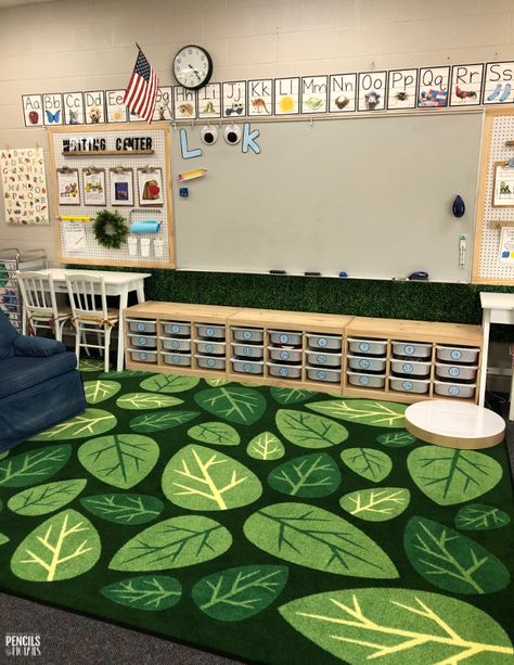 Green Preschool Classroom, Green Daycare Room, Tree Theme Classroom, Library Rug Ideas, Woodsy Classroom Bulletin Boards, Garden Decor Classroom, Garden Of Eden Classroom Decor, Elementary Classroom Decor Plants, Environment As The Third Teacher