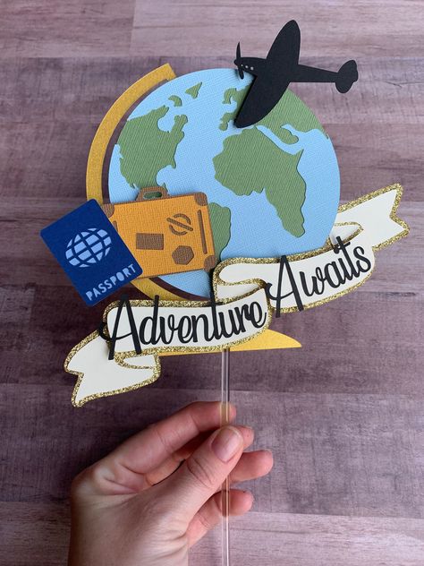 "Welcome to Mandi and Mari Designs!  This listing is for an Adventure Awaits cake topper that measures approximately 7.5 inches wide. The topper is a globe featuring and plane silhouette, a suitcase, a passport and a banner that reads \"Adventure Awaits\". 3D spacers were used on the topper to give it some dimension and sealed glitter cardstock is used so no glitter mess on your cake. The topper is attached to one clear acrylic stick that measures approximately 6 inches long prior to attaching i Bon Voyage Retirement Party Ideas, Adventure Awaits Cake Ideas, Travel Theme Baby Shower Ideas, Adventure Awaits Cake, Travel Theme Party Decorations, Travel Cake Topper, Plane Trip, Travel Baby Showers, Travel Cake