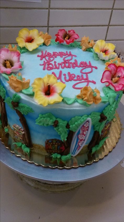 Hawaiian decorated cake Hawaii Cake Ideas Hawaiian Birthday, Hawaii Cake Ideas, Hawaiian Cake Ideas, Hawaii Birthday Cake, Hawaiian Party Cake, Luau Party Cakes, Hawaiian Theme Cakes, Hawaiian Birthday Cakes, Tiki Cake