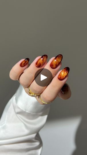 1.4M views · 63K reactions | 🍁✨ glittery amber marble for a touch of autumn elegance 🍂☕️  ✨ I used DVOK espresso marble gel and base from @sweetienailsupply ✨ for 10% off use code: AISTE   *other products used are linked on my amzn in the bio  _____ *affiliate #fallnails #glitternails #marblenails #brownnails #nails #nailinspo #nailtutorials #diynails orange amber nails aura ombre gradient, almond nails, simple classy cate velvet | Aistė Haas | LISA · New Woman Pink Gold Nails Design, Amber Nails, Pink Gold Nails, Orange Nail Designs, Gold Nail Designs, Cat Eye Nails, Fall Nail Colors, Brown Nails, Festival Nails