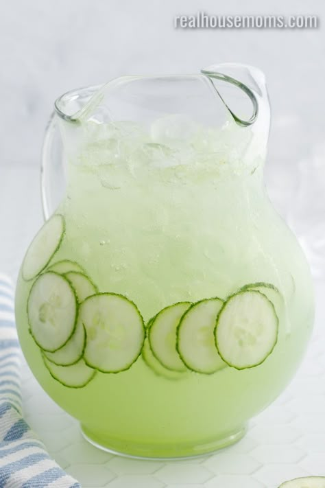 Light and refreshing Cucumber Punch is perfect for the whole family or can be turned into a yummy cocktail for grown-ups! #RealHousemoms #cucmber #limeade #punch #cocktail #drinks #girlsnight #familyfriendly #stpatricksday Cucumber Punch Recipe, Cucumber Reviver Cpk Recipe, Cucumber Drinks Non Alcoholic, Cucumber Lemonade Cocktail, Cucumber Lime Drink, Drinks With Cucumber Vodka, Cucumber Alcoholic Drinks, Cucumber Drink Alcohol, Cucumber Vodka Drinks Cocktail Recipes