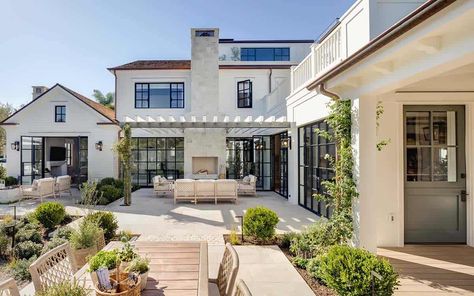 Step into this Newport Beach house with a stunning East coast vibe Newport Beach House, Beach House Tour, Steel Doors And Windows, East Coast Style, Potted Plants Outdoor, Front Courtyard, Cozy Patio, Wood Beam Ceiling, Outdoor Pots