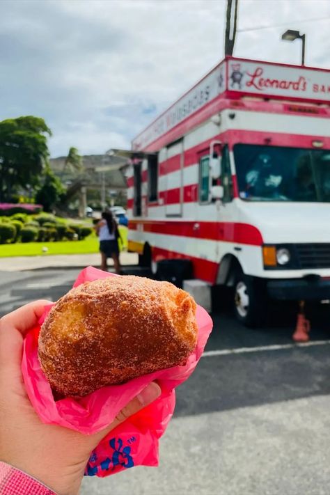 a hand holding up a malasada next to Leonard's Bakery food truck Bakery Food Truck, Crepe Cafe, Haupia Pie, Iolani Palace, Must Try Food, Growing Pineapple, Hawaii Holiday, Pecan Rolls, Bakery Food