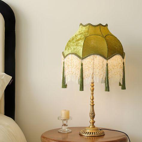 The Kennedy Fabric Table Lamp from dekorfine features a charming vintage design with a scalloped fabric shade in a soft green hue, adorned with delicate fringe detailing. The intricately crafted brass base adds a touch of elegance and stability. This lamp provides a warm, ambient light, perfect for creating a cozy and inviting atmosphere in any room. A beautiful blend of classic and timeless design, the Kennedy Fabric Table Lamp is an exquisite addition to your home decor. If you have any questi Tasseled Lamp Shade, Scalloped Fabric, Fringe Lamp, Pretty Interiors, Vintage Lamp Shade, Fabric Floor Lamp, Victorian Lamp, Table Lamp Vintage, Candle Warmer Lamp