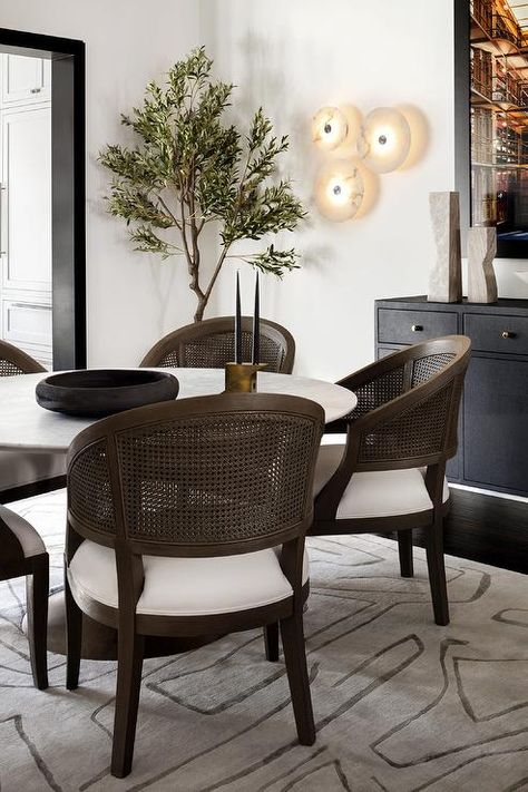 Transitional Dining Room With Round Table, Dining Room Circular Table, Transitional Dining Room Round Table, Old Furniture In Modern Home, Wood Dining Table Decor, Dining Room With Round Table, White Slipcovered Chair, Black Credenza, Dining Room Credenza