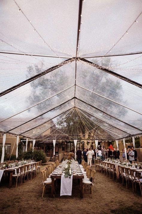 An elegant tent, canopy lights, and cross back chairs for a romantic and earthy outdoor reception | Image by a A Fist Full of Bolts  #weddingreception #reception #weddingdecor #earthywedding #modernwedding #wedding #weddinginspiration #outdoorwedding