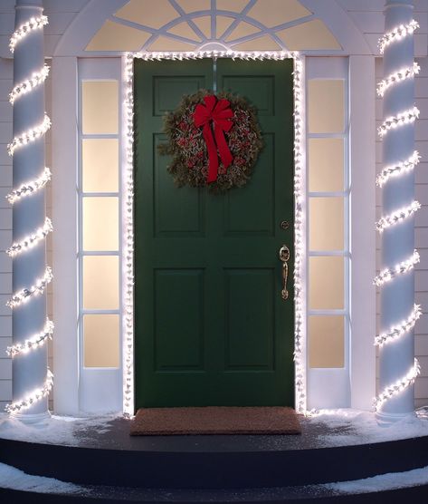 Wrap white lights around your pillars and doorframe - ELLEDecor.com Porch Xmas Lights, Exterior Christmas Decorations, Pillar Decor, House Pillars, Porch Decoration Ideas, Porch Pillars, Cow Skull Decor, Christmas Front Porch Ideas, Exterior Christmas