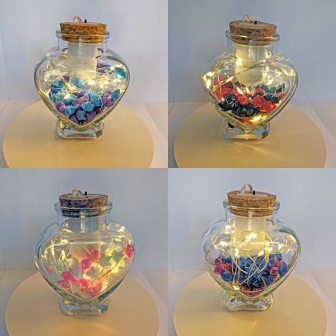 These origami stars are folded by hand from plastic straws. They make lovely gifts, stocking stuffers, night light, or household decoration. Each heart shaped glass jar contains 60 stars of one or two colors of your choosing. Origami Jar, Fairy Led Lights, Plastic Rose, Jar Of Hearts, Heart Diy, Clear Jars, Origami Stars, Jar Lights, Household Decor