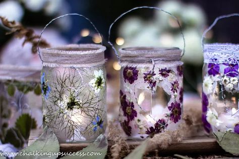 Today I'm sharing how to make magical glass jar lanterns with pressed flowers. These pretty luminaries are perfect for lighting up summer and autumn evenings indoors or out! ﻿If you are looking for DIY party decorating ideas, these glass jar lanterns will make a lovely table decoration. Hang them up outside in the trees as rustic wedding or birthday party decorations. It's an easy craft for adults and children alike. See the how-to VIDEO here. Visit my blog for the full tutorial. (See… Flower Wall Stencil, Plastic Bottle Tops, Flower Lamp Shade, Flower Projects, Soda Can Art, Sweet Candles, Pressed Flower Crafts, Pink Napkins, Candle Wrap