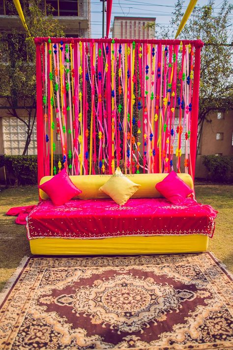 Photo of Colourful haldi decor with a bright pink theme. Rakshabandhan Decoration Ideas At Home, Holi Decorations Ideas At Home, Holi Theme Decoration At Home, Mayon Decor, Mehendi Stage, Sangeet Inspiration, Mehendi Backdrop, Mehndi Backdrop, Mehandi Decorations