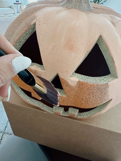 painting the DIY terracotta pumpkin Diy Terracotta Pumpkin, Terracotta Halloween, Spray Paint Ceramic, Terracotta Pumpkins, Pumpkin Spray Paint, Textured Spray Paint, Terracotta Paint, Sugar Skull Halloween, Leftover Paint