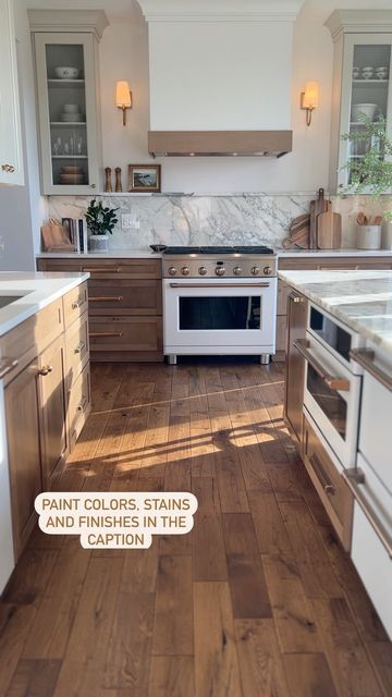 Stained Lowers White Uppers, Earth Tone Kitchens, Beige And Wood Kitchen, White Upper Cabinets Wood Lower, Bronze Kitchen Hardware, Creek Forest, Earth Tones Kitchen, Appliances White, Kraftmaid Kitchen Cabinets