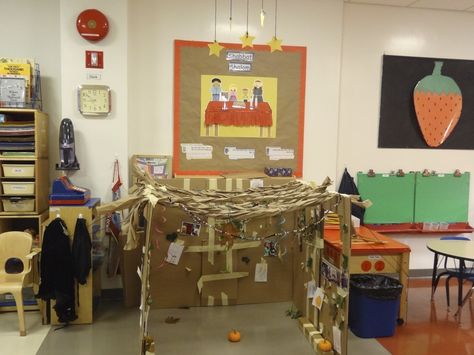 Classroom sukkah - with cardboard boxes, tape, and bulletin board paper.  The children decorated with beads, drawings, photos, and things they collected from outside.   3 stars hanging above the schach. Sukkot Activities, Sukkot Crafts, Drawings Photos, Emergent Curriculum, Bulletin Board Paper, Sukkot, Red Rooms, Cardboard Box, Bulletin Board