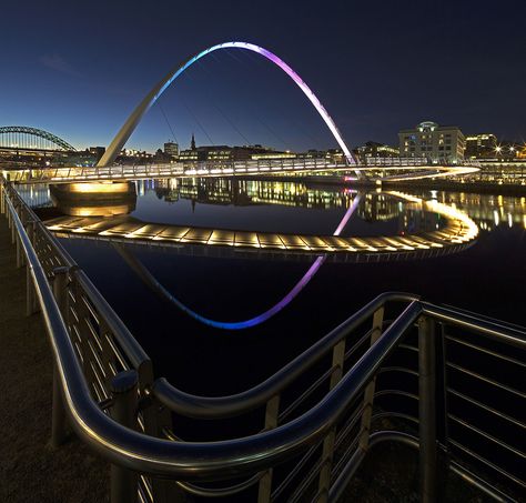 A view of the Millennium Bridge at dusk, reflected in the Ruiver Tyne. As seen from Gateshead Quays. Gateshead Millennium Bridge, Newcastle Gateshead, Gcse Photography, England History, Millennium Bridge, Tyne And Wear, Fair Projects, Science Fair Projects, Newcastle Upon Tyne