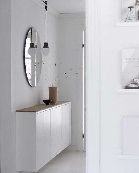 Love an IKEA hack?! This genius storage in the Norwegian hallway of @line_hamre has been fashioned out of EKET cabinets and a left over… Vstupná Hala, Ikea Eket, White Hallway, Design Ložnic, My Scandinavian Home, Hallway Cabinet, Green Hallway, Hallway Inspiration, Hal Decor