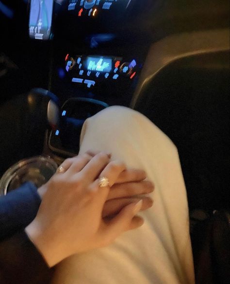 late night interior of a car with a man holding a woman’s hand rested on her lap, wearing white flare denim pants and peal and gold rings Holding Hands Driving Aesthetic, Driving Holding Hands, Holding Thigh Couple Aesthetic, Holding Thigh Couple, Late Night Drives With Boyfriend, Couple Driving Aesthetic, Couple Quality Time, Hand On The Thigh Couple, Hand On Thigh Night Car