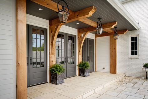 Gas lanterns add charm to this gorgeous entry way from Allard Ward Architects. Landscape House, Casa Clean, Farmhouse Exterior Design, Interior Design Minimalist, Kabinet Dapur, European Farmhouse, Farmhouse Front Porches, Farmhouse Front, Modern Farmhouse Exterior