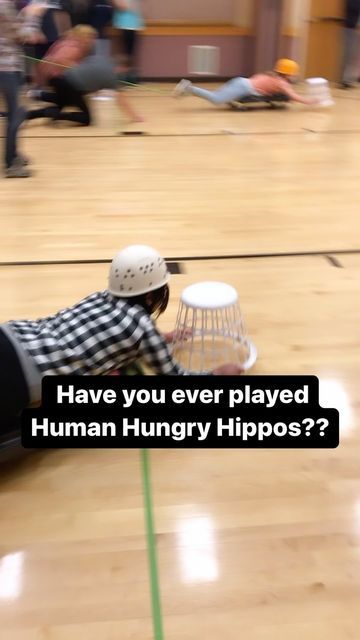 McKell Moeller- Utah Fun on Instagram: "Looking for a fun game for a youth group or family gathering? Human Hungry Hippos is the answer. How to play: Split up into 4 teams. Each round will last two minutes. Each team will start in their corner behind the tape line. One player with lay down on the scooter holding the basket and act as the hippos mouth to try and drag back as many balls to their corner as they can. The other players on the team will push and pull the player laying on the scoot Human Hungry Hippo Game, Hungry Hippo Human Game, Hungry Hippo Game, Human Hungry Hippos, Hippo Mouth, Utah Adventures, Hungry Hippos, Push And Pull, Pushes And Pulls