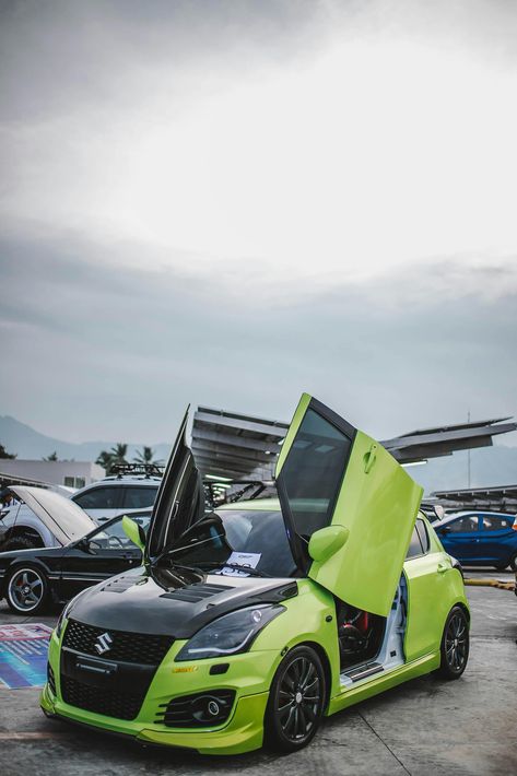 Suzuki Swift Modified with lambo doors. she is looking pretty💚 Modified Swift, Swift Modified, Suzuki Swift Sport, Around The World In 80 Days, Travel Toothbrush, Mercedes Benz Cars, Vintage Classics, Shop Organization, Benz Car