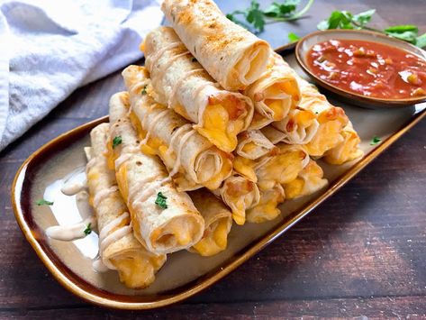 Beef And Cheese Taquitos, Spicy Sour Cream, Cheese Taquitos, Cinnamon Roll Monkey Bread, Taquitos Recipe, Burrito Recipe, Fried Beef, Baked Cheese, Food Lab