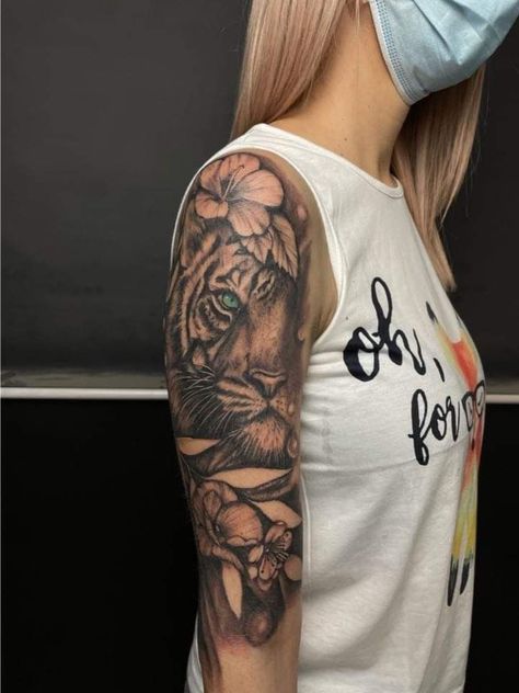 Tiger Flower Sleeve Tattoo, Tiger Sunflower Tattoo, Shoulder Tiger Tattoos For Women, Tiger And Hibiscus Tattoo, Tiger Half Sleeve Tattoo For Women, Women’s Tiger Tattoo, Tiger Shoulder Tattoo Woman, Tiger Arm Tattoo Woman, Half Tiger Half Woman Tattoo