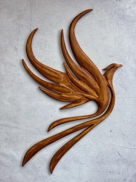 Another piece finished today. Phoenix... - Knight Woodcraft Wooden Carving Design, Phoenix Knight, Bird Carving Patterns, Bois Intarsia, Bird Silhouette Art, Wood Laser Ideas, Carved Headboard, Wood Craft Patterns, Simple Wood Carving