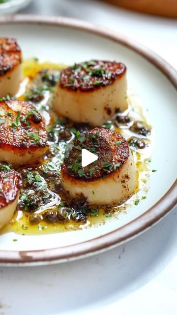 Nadia Aidi on Instagram: "Scallops Meunière for ep.5 of my restaurant series ♥️ fun fact? I was on seafood duty for most of my restaurant career. Scallops are easy if you follow these tips:

Tip 1: I like to take a blow dryer or a fan on COOL and dry surface on both sides to draw out moisture and get a nice hard sear. You can leave  it uncovered in the fridge for a couple hrs.

Tip 2: When buying scallops try to get ‘dry’ vs ‘wet’ because they will sear & taste better but also you won’t be getting scallops that have been injected with water. 

Tip 3: Give them a lil shake when searing (always on a preheated pan) so they don’t stick but then let them be to develop a hard sear. I always sear 4-5 min on one side and 30-60 sec on the other depending on size.

Ingredients:
* 10 U-10 scallops.
* Scallops Recipes, Seafood Dinners, Dried Scallops, Shell Fish, Seafood Entrees, Yummy Seafood, Salad Spinner, Scallop Recipes, Let Them Be