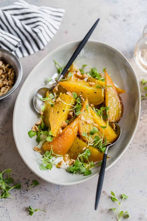 Roasted golden beets with horseradish, walnuts, and arugula is a show stopper of a side dish for any fall or winter gathering! The beets roast for an hour with olive oil, salt, and pepper until tender throughout. Gently peel the skin, then serve over a creamy horseradish cream and serve with walnuts and micro greens. Pair them with roasted chicken to make a more filling meal. #roasted #goldenbeets #beets #sidedish #delicious | wellseasonedstudio.com @wellseasonedstudio Roasted Golden Beets, Winter Gathering, Gluten Free Salads, Golden Beets, Gluten Free Sides, Beet Recipes, Autumn Salad, Winter Salad, Holiday Side Dishes