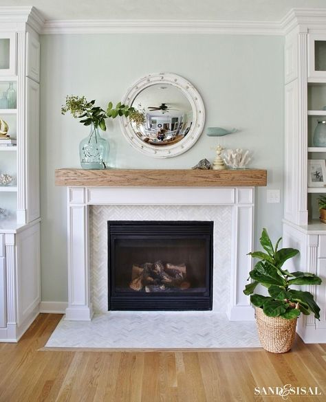 Herringbone tiles are always a good idea! Just look at this stunning fireplace. Coastal Family Rooms, Coastal Fireplace, Beam Mantel, Diy Fireplace Mantel, Fireplace Redo, Wood Fireplace Mantel, Wood Beam, Coastal House, Farmhouse Fireplace