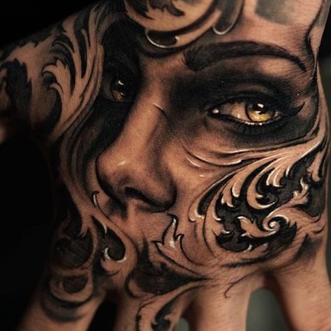 Woman's face and filigree hand tattoo by James Strickland. #realism #blackandgrey #JamesStrickland #woman #face #womansface #filigree #handtattoo Filligree Tattoos Designs, Filligree Tattoos, Shaded Tattoo, Skull Hand Tattoo, Catrina Tattoo, Skull Girl Tattoo, Filigree Tattoo, Girl Face Tattoo, Chicano Style Tattoo