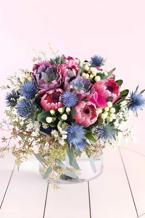 Featured Flowers: Protea, Thistle, Succulents, Coffee Beans, and Limonium

Recommended for: Birthday, Friendship, Congratulations, Housewarming, and Get Well Unique Succulents, Blue Flower Arrangements, Luxury Bouquet, Unexpected Beauty, Blue Thistle, Get Well Flowers, Thank You Flowers, Romantic Bouquet, Navy Blue Flowers