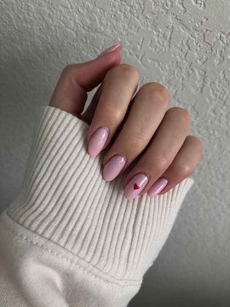 Pink Nail Red Heart, Pink Nails Valentine's Day Simple, Pink Nails With One Heart, Birthday Shellac Nails, Pink Nails With Red Heart On Ring Finger, Pink Nails With Small Heart, Single Heart Nails, Light Pink Nails With Red Heart, Short Oval Valentines Nails