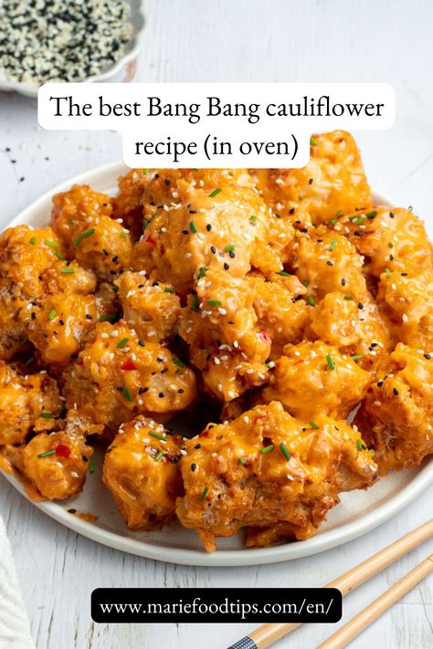 This irresistibly crispy baked cauliflower bites, perfectly coated in a spicy bang bang sauce, is as easy to make as it is delicious! Baking Cauliflower In Oven, Meals For Two Vegetarian, Cauliflower Bites Recipes, Spring Time Recipes, Crispy Cauliflower Recipes, Healthy Junk Food Recipes, Cauliflower Bites Baked, Oven Baked Cauliflower Recipes, Healthy Spicy Snacks