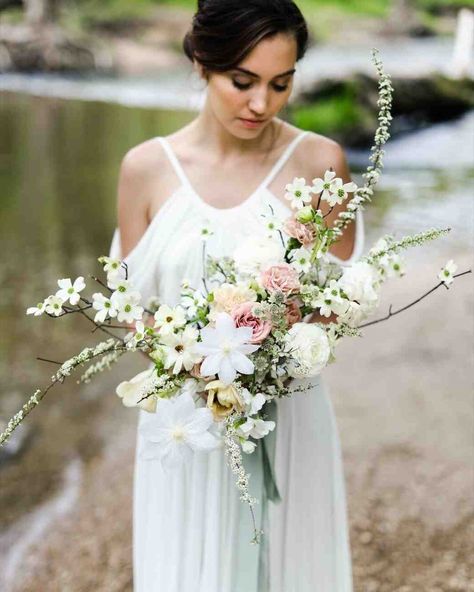 A Floral Trend We're Loving: Dogwood Wedding Bouquets #WeddingBouquets #WeddingFlowers #WeddingColors #WeddingInspiration | Martha Stewart Weddings - A Floral Trend We're Loving: Dogwood Wedding Bouquets Dogwood Wedding, Handfasting Wedding, Modern Wedding Bouquets, Bridal Bouquet Spring, Cascading Wedding Bouquets, Round Bouquet, Wedding Dress Silhouette, Rose Wedding Bouquet, Cascade Bouquet